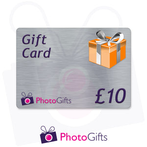Grey £10 gift card with the writing Gift Card and Photogifts Logo as well as a picture of a gold wrapped box
