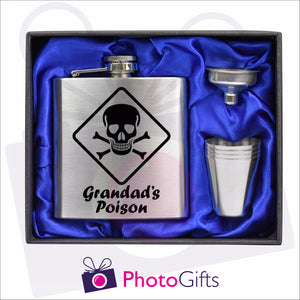 Open boxed gift set of a silver hip flask with silver funnel and four matching shot glasses. Hip flask  with the words Grandad's Posion and a picture of a skull and cross bones personalised on the flask. Flask set as produced by Photogifts.co.uk