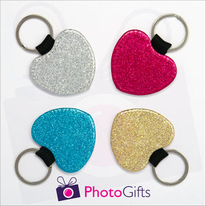 Four glitter heart shaped keyrings. Each keyring is a single coloured glitter in either red, blue, silver or gold. Also shown is the Photogifts logo. Keyring as produced by Photogifts.co.uk