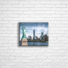 Load image into Gallery viewer, Personalised 10x8" Landscape wrapped canvas with your own choice of image hung on a white brick wall by Photogifts.co.uk