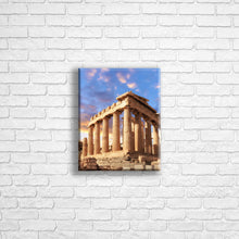 Load image into Gallery viewer, Personalised 10x8" portrait border canvas with your own choice of image hung on a white brick wall by Photogifts.co.uk