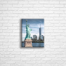 Load image into Gallery viewer, Personalised 10x8" Portrait wrapped canvas with your own choice of image hung on a white brick wall by Photogifts.co.uk