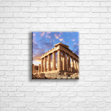 Load image into Gallery viewer, Personalised 12x12" square border canvas with your own choice of image hung on a white brick wall by Photogifts.co.uk