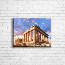 Load image into Gallery viewer, Personalised 16x12" landscape border canvas with your own choice of image hung on a white brick wall by Photogifts.co.uk
