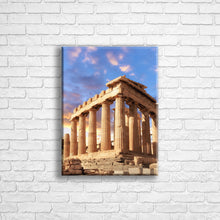 Load image into Gallery viewer, Personalised 16x12" portrait border canvas with your own choice of image hung on a white brick wall by Photogifts.co.uk