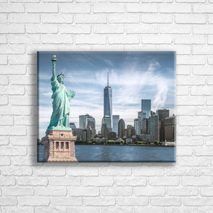 Personalised 20x16" landscape wrapped canvas with your own choice of image hung on a white brick wall by Photogifts.co.uk