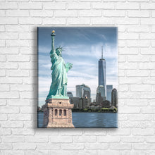 Load image into Gallery viewer, Personalised 20x16" portrait wrapped canvas with your own choice of image hung on a white brick wall by Photogifts.co.uk