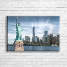 Load image into Gallery viewer, Personalised 24x16" landscape wrapped canvas with your own choice of image hung on a white brick wall by Photogifts.co.uk