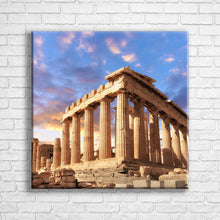 Load image into Gallery viewer, Personalised 24x24" square border canvas with your own choice of image hung on a white brick wall by Photogifts.co.uk