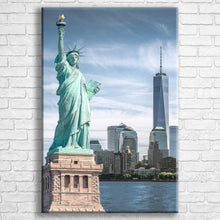 Load image into Gallery viewer, Personalised 30x20" portrait wrapped canvas with your own choice of image hung on a white brick wall by Photogifts.co.uk