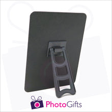 Load image into Gallery viewer, Rear view of faux leather customised photo panel 252mm x 202mm (10" x 8") in portrait orientation. Picture details show plastic easel stand on back of the panel