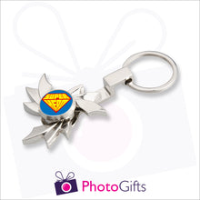 Load image into Gallery viewer, Personalised fidget spinner in flame shape on a keyring. Centre part of spinner is customised with your own choice of image as supplied by Photogifts.co.uk