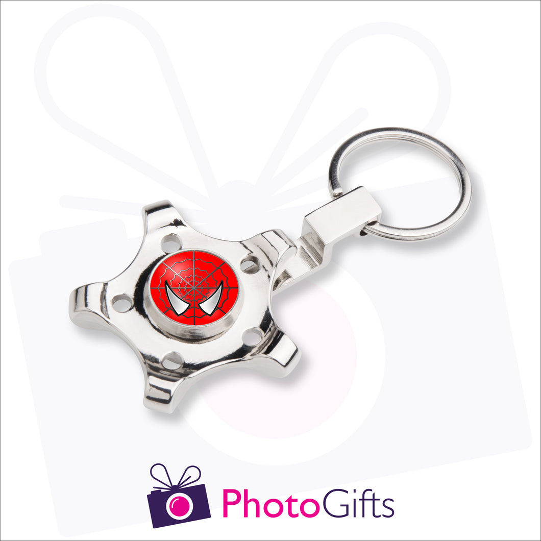 Fidget spinner in the shape of a wheel or cog mounted onto a keyring. The centre spot of the spinner can be personalised with your own choice of image as supplied by Photogifts.co.uk