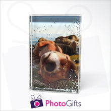 Load image into Gallery viewer, 152mm x 102mm (6" x 4") clear acrylic freestanding block, in portrait orientation, that can be personalised with your own choice of image. The block is filled with tiny silver glitter suspended within a clear liquid. The chosen image is clipped to the back of the block and shows through so you can see it behind the liquid. When the block is shaken the silver glitter will slowly make its way down to the bottom of the block similar to a snow globe