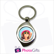 Load image into Gallery viewer, Metal leaf shaped pendant keyring with your own choice of image in the centre as produced by Photogifts.co.uk
