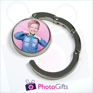 Round bag hanger with your own choice of image in the centre is partially open as produced by Photogifts.co.uk