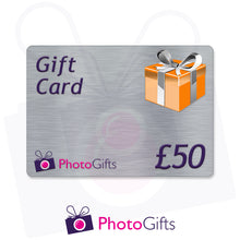 Load image into Gallery viewer, Grey £50 gift card with the writing Gift Card and Photogifts Logo as well as a picture of a gold wrapped box
