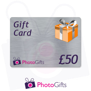 Grey £50 gift card with the writing Gift Card and Photogifts Logo as well as a picture of a gold wrapped box