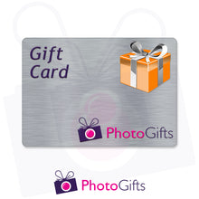 Load image into Gallery viewer, Grey card with the writing Gift Card and Photogifts Logo as well as a picture of a gold wrapped box
