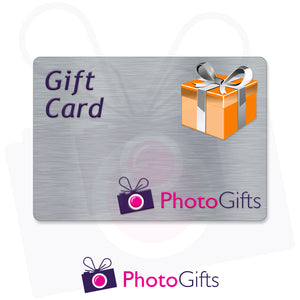 Grey card with the writing Gift Card and Photogifts Logo as well as a picture of a gold wrapped box