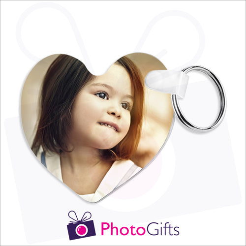 Heart shaped double sided plastic keyring that can be customised with your own chosen image as produced by Photogifts.co.uk