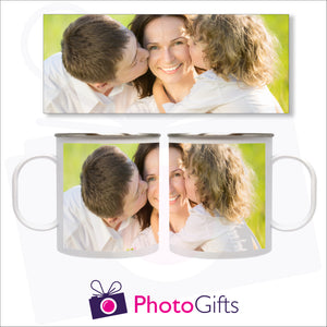 white plastic mug shown from the right and the left with the picture of a mum being kissed on either side of her face by two children. Above the mug is a full depiction of the picture shown on the mug. Mug as supplied by Photogifts.co.uk