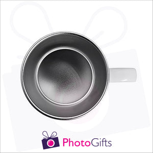 White plastic mug with stainless steel interior seen from above with the handle to the right of the picture. Mug can be personalised by Photogifts.co.uk