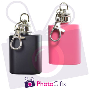 Front view showing keyring clip on two mini hip flasks, one pink one black, on keyrings as produced by Photogifts.co.uk