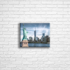 Personalised 10x8" Landscape wrapped canvas with your own choice of image hung on a white brick wall by Photogifts.co.uk