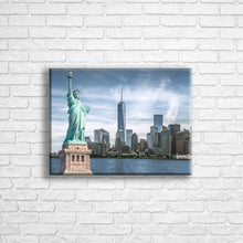 Load image into Gallery viewer, Personalised 16x12&quot; Landscape wrapped canvas with your own choice of image hung on a white brick wall by Photogifts.co.uk
