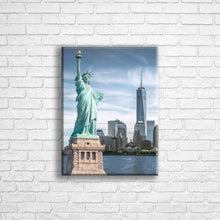 Load image into Gallery viewer, Personalised 16x12&quot; portrait wrapped canvas with your own choice of image hung on a white brick wall by Photogifts.co.uk
