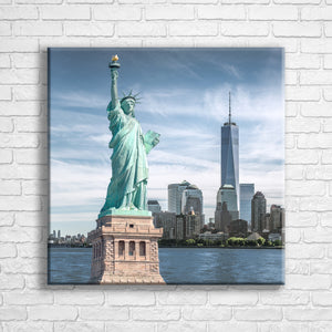 Personalised 24x24" square wrapped canvas with your own choice of image hung on a white brick wall by Photogifts.co.uk