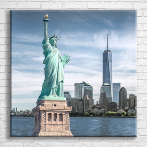 Personalised 30x30" square wrapped canvas with your own choice of image hung on a white brick wall by Photogifts.co.uk