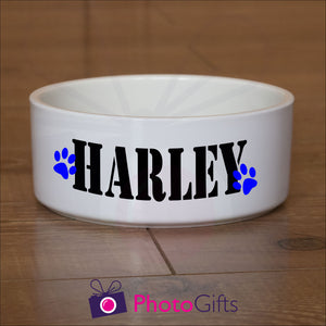 White ceramic pet bowl with the name "Harley" and two paw prints printed on the sides of the bowl as supplied by Photogifts.co.uk