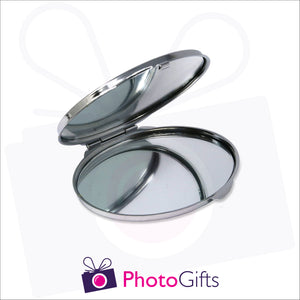 Partially opened personalised oval compact mirror with your own choice of image on the front as produced by Photogifts.co.uk