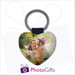 Double sided faux leather heart shaped keyring with your own choice of image on both sides as produced by Photogifts.co.uk