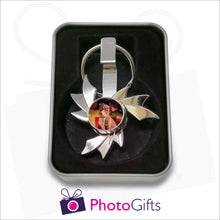 Load image into Gallery viewer, Flame shaped fidget spinner on keyring that is personalised with your own choice of image in presentation tin as supplied by Photogifts.co.uk
