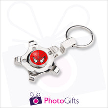 Load image into Gallery viewer, Fidget spinner in the shape of a wheel or cog mounted onto a keyring. The centre spot of the spinner can be personalised with your own choice of image as supplied by Photogifts.co.uk

