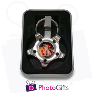 Personalised wheel or cog shaped fidget spinner keyring presented in gift tin as supplied by Photogifts.co.uk