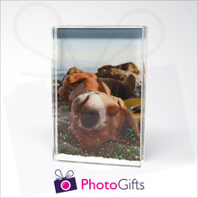 Load image into Gallery viewer, 152mm x 102mm (6&quot; x 4&quot;) clear acrylic freestanding block, in portrait orientation,  that can be personalised with your own choice of image. The block is filled with tiny snow flakes suspended within a clear liquid. The chosen image is clipped to the back of the block and shows through so you can see it behind the liquid. When the block is shaken the snow flakes will slowly make its way down to the bottom of the block similar to a snow globe
