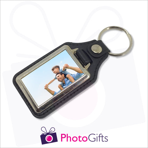 Traditional leather keyfob style with your own choice of image printed on one side. Image is rectangular in shape and in a small metal frame.