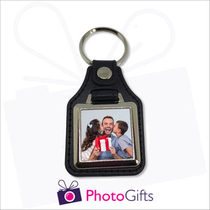 Traditional leather keyfob style with your own choice of image printed on one side. Image is square in shape and in a small metal frame.