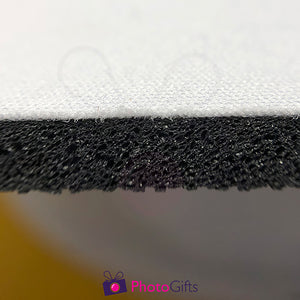 Close up photograph of the top fabric and black base of the personalised mouse mat as produced by Photogifts.co.uk