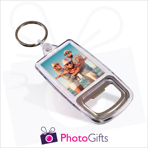 Plastic double sided keyring with a metal bottle opener inbuilt into one end. Your own image is displayed on both sides of the keyring