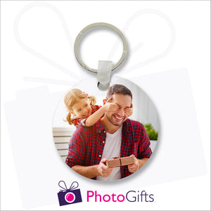 Round shaped tough and durable double sided plastic keyring with your own choice of images printed on both sides as produced by Photogifts.co.uk