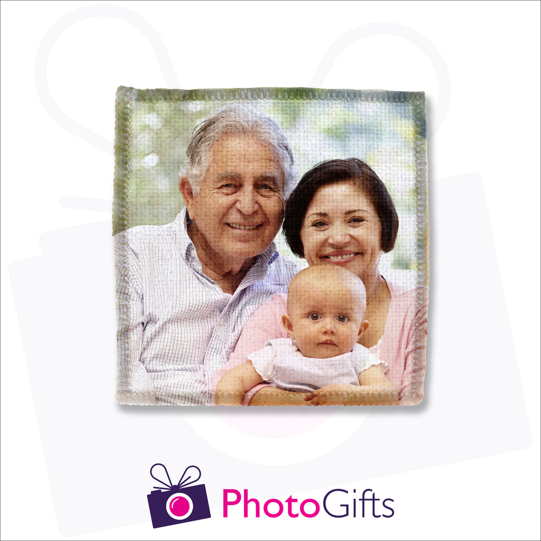 An individually personalised square linen coaster with your own choice of image as produced by Photogifts.co.uk